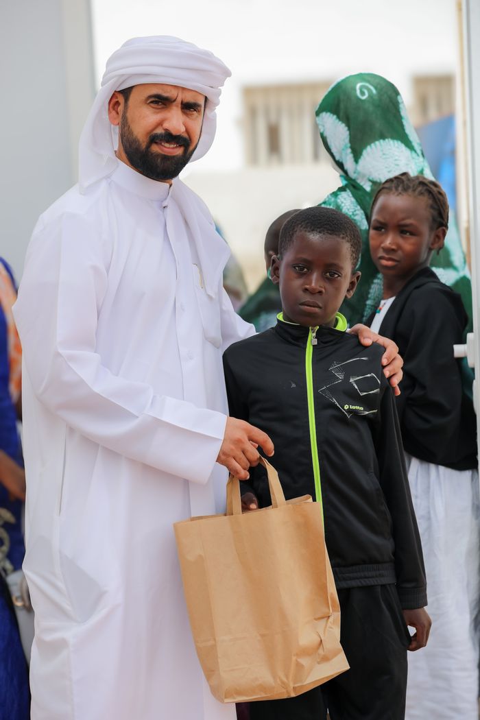 The Art of Drawing Readers In: Your attractive post title goes here A heartwarming moment capturing a charity event with multicultural attendees, fostering unity.